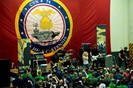 US Navy 111124-N-OY799-242 The Natalie Stovall Band performs for the crew in hangar bay two aboard the Nimitz-class aircraft carrier USS John C. St