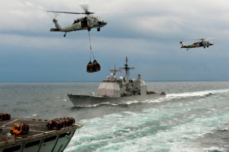 US Navy 111122-N-BT887-176 An MH-60S Sea Hawk helicopter from the Eightballers of the Helicopter Sea Combat Squadron (HSC) 8 lifts cargo from the M