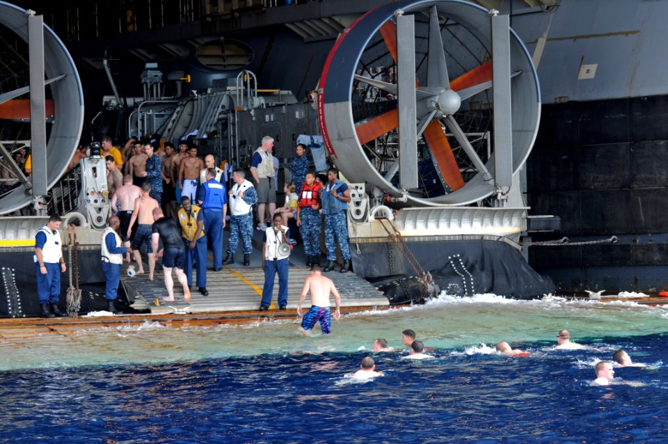 US Navy 111125-N-MW330-376 Sailors and Marines participate in a swim call from the multi-purpose amphibious assault ship USS Essex (LHD 2)
