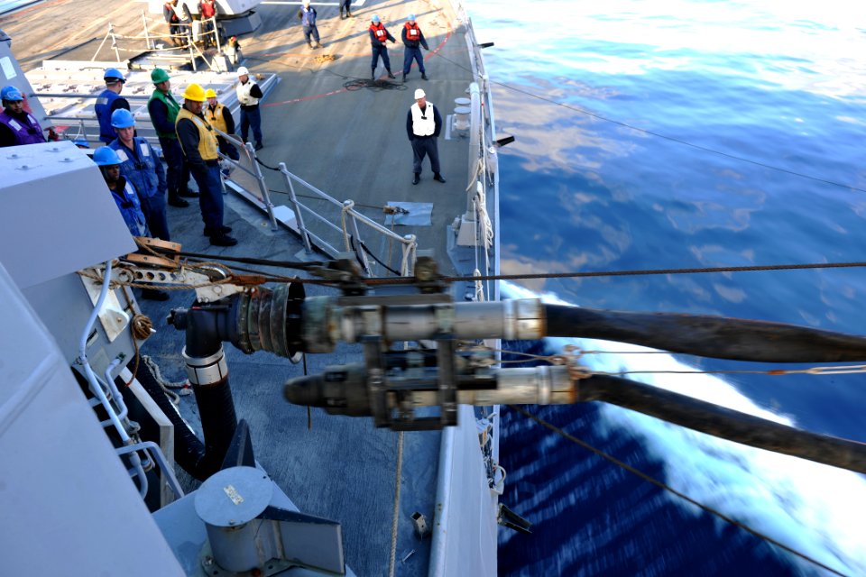 US Navy 111129-N-YZ751-035 Sailors and Military Sealift Command personel conduct a replenishment at sea