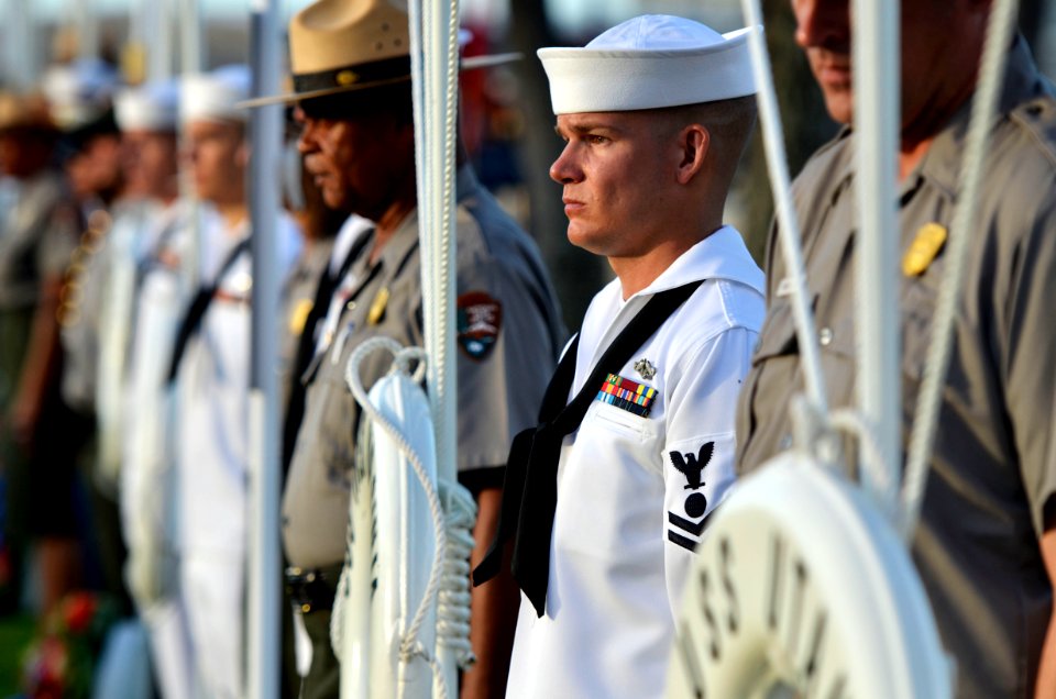 US Navy 111207-N-WP746-190 A Sailor is offering a wreath during the 70th anniversary of Pearl Harbor Day