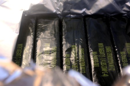 US Navy 111213-N-BA263-596 Composition C-4 demolition charges await use as explosive ordnance disposal technicians assigned to Commander, Task Grou photo