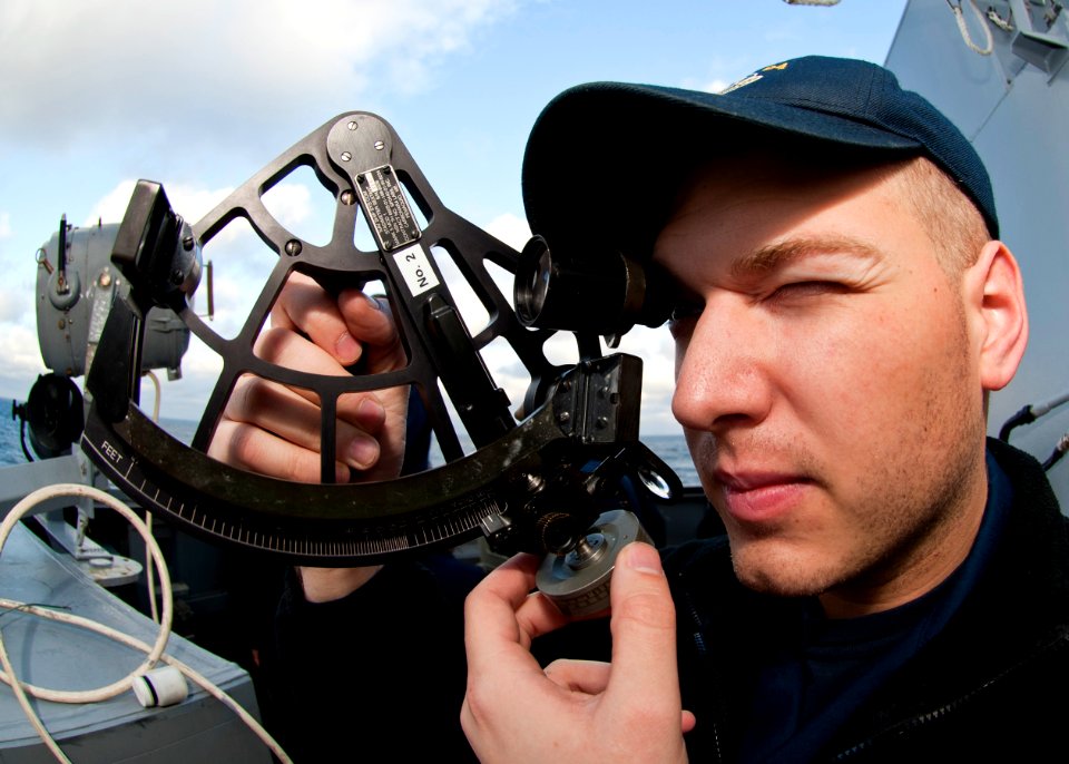 US Navy 111213-N-FI736-012 Ensign Thomas Early uses a stadimeter to find the distance
