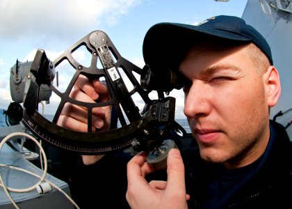 US Navy 111213-N-FI736-012 Ensign Thomas Early uses a stadimeter to find the distance