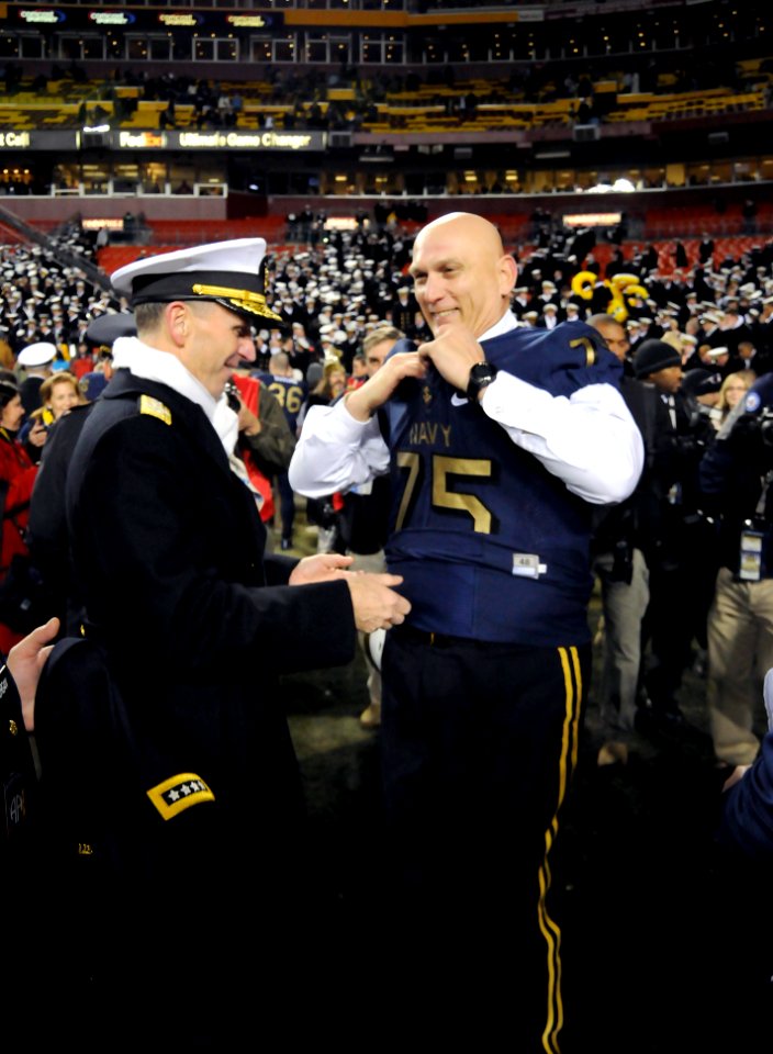 US Navy 111210-N-FC670-150 Chief of Naval Operations (CNO) Adm. Jonathan Greenert, left, helps Chief of Staff of the Army Gen. Raymond T. Odierno p
