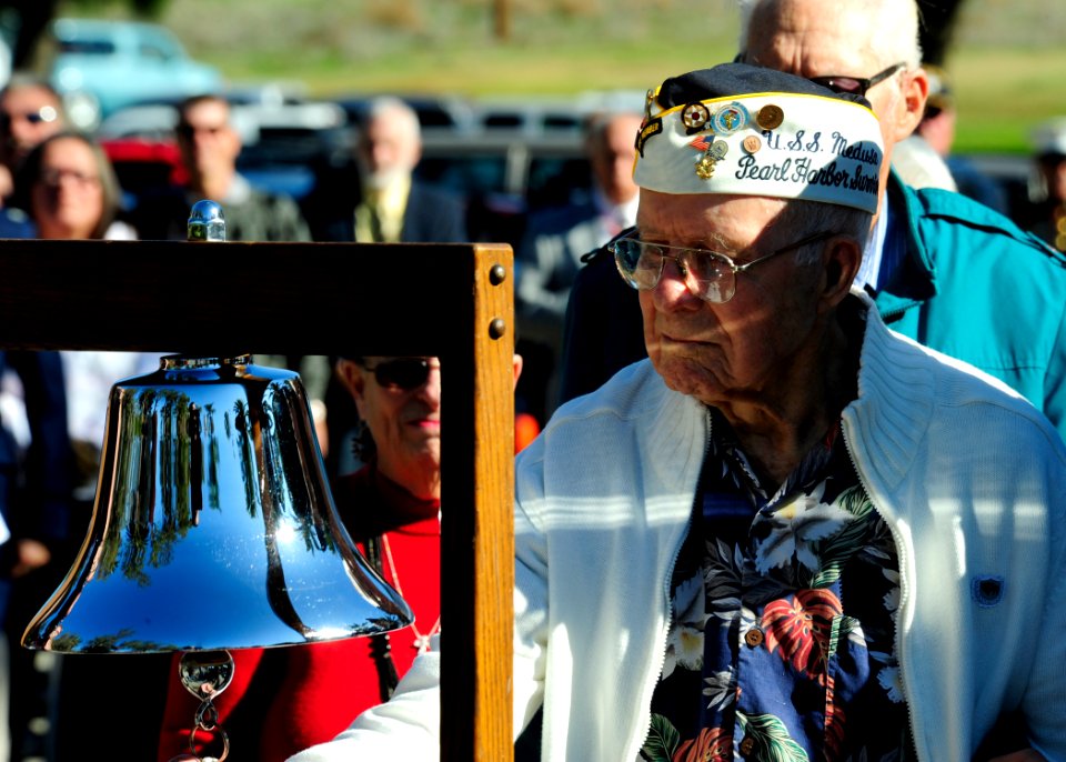 US Navy 111207-N-YM863-192 A Pearl Harbor survivor rings the bell signifying the time of day in which the attack took place
