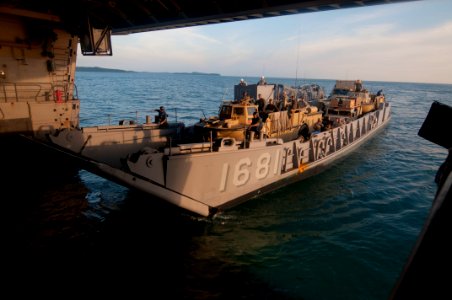 US Navy 111211-N-PB383-726 Crew members enter the well deck of the amphibious transport dock ship USS New Orleans