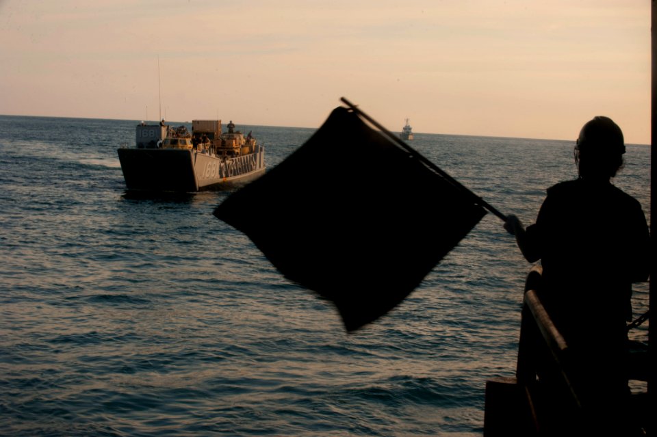 US Navy 111211-N-PB383-902 An assault craft approaches the well deck