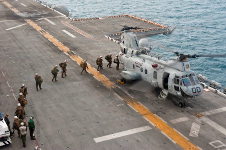 US Navy 111214-N-DX615-171 Marines embark a CH-46E Sea Stallion helicopter photo