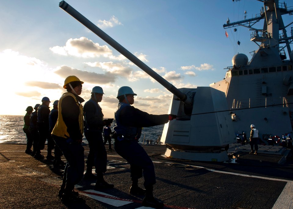 US Navy 111214-N-FI736-144 Sailors handle the phone and distance line during an underway replenishment aboard the Arleigh Burke-class guided-missil