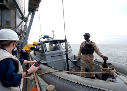 US Navy 111213-N-NR955-010 Sailors assigned to the Whidbey Island-class amphibious dock landing ship USS Gunston Hall (LSD 44) drop an 11-meter rig