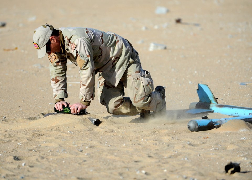 US Navy 111212-N-BA263-544 Explosive Ordnance Disposal Technician 1st Class Mike Dillon, assigned to Commander, Task Group 56.1, places a compositi