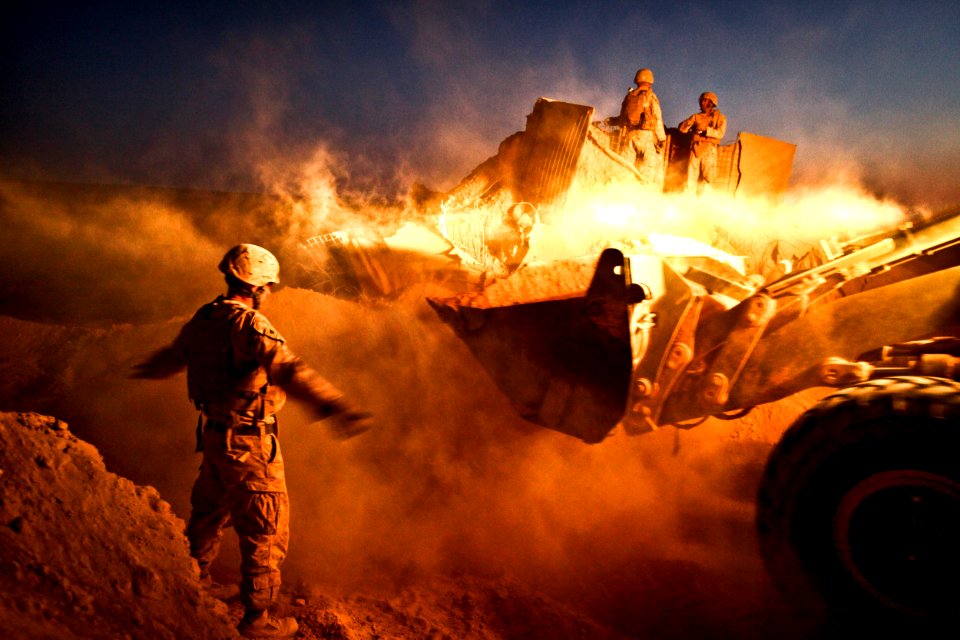 US Navy 111214-M-PH073-626 A bulldozer moves the berm surrounding a guard post at Firebase Saenz, Helmand province, Afghanistan