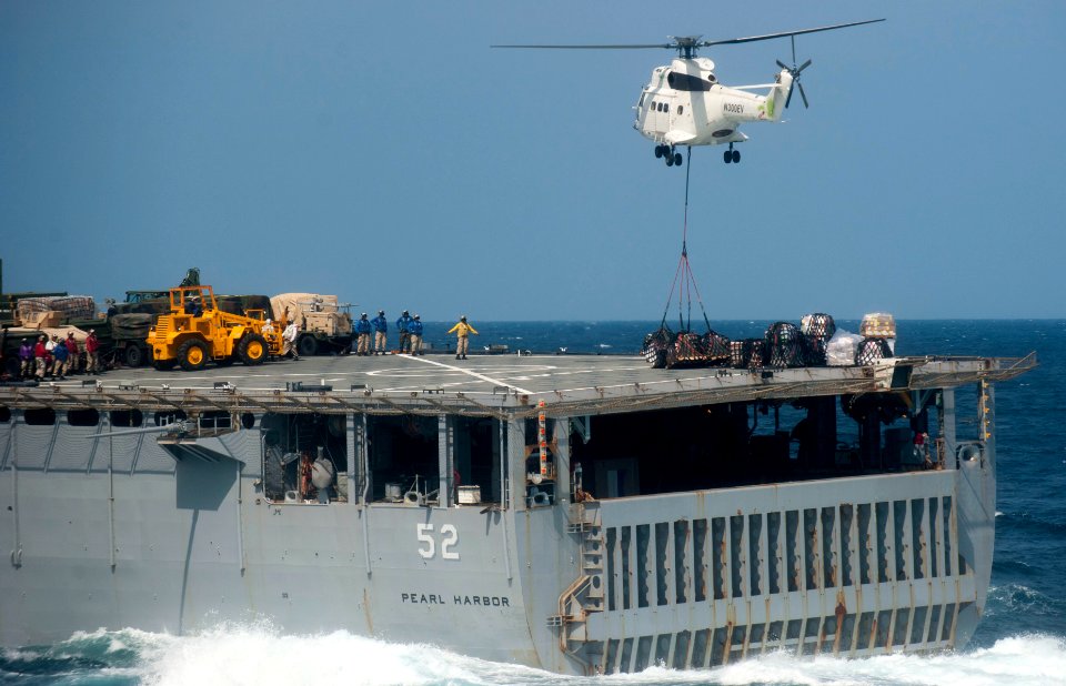 US Navy 111210-N-PB383-909 A helicopter from the Military Sealift Command dry cargo and ammunition ship USNS Alan Shepard (T-AKE 3) delivers suppli