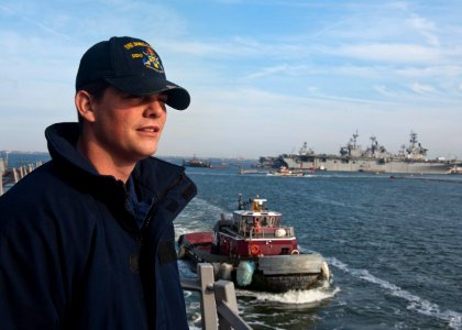 US Navy 111215-N-FI736-116 Information Systems Technician 3rd Class Erick Tiernan watches as Arleigh Burke-class guided-missile destroyer USS James