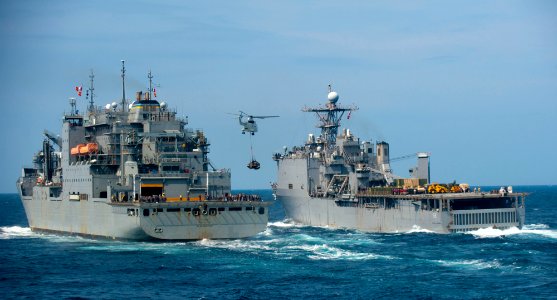 US Navy 111210-N-PB383-953 A helicopter from the Military Sealift Command dry cargo and ammunition ship USNS Alan Shepard (T-AKE 3) delivers suppli
