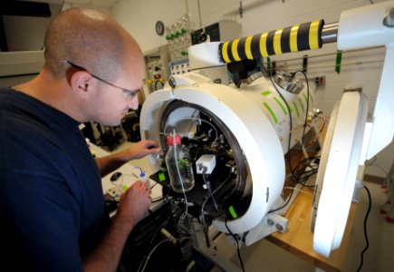 US Navy 111215-N-PO203-079 Lt. Denis Colomb, principal investigator with the Navy Experimental Diving Unit, places a whole-cell recording electrode