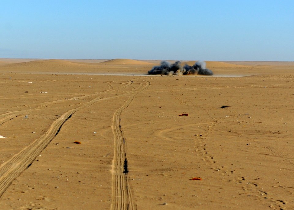 US Navy 111213-N-BA263-655 Explosive ordnance disposal technicians, assigned to Commander, Task Group (CTG) 56.1, destroy a 155mm projectile during