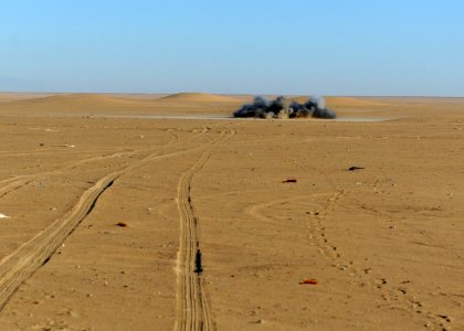 US Navy 111213-N-BA263-655 Explosive ordnance disposal technicians, assigned to Commander, Task Group (CTG) 56.1, destroy a 155mm projectile during