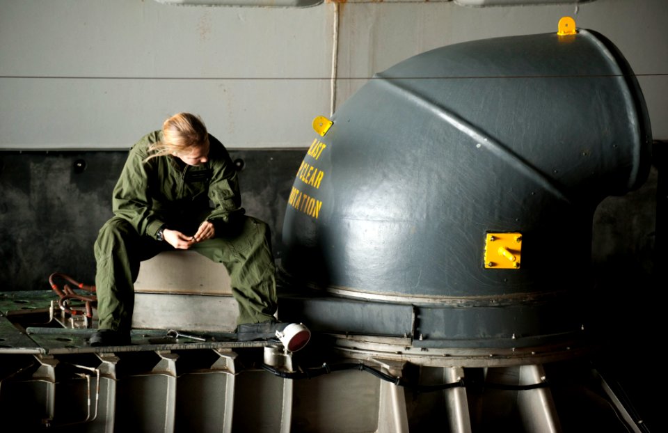 US Navy 111211-N-PB383-232 A Sailor conducts maintenance on the bow of a thruster of a landing craft