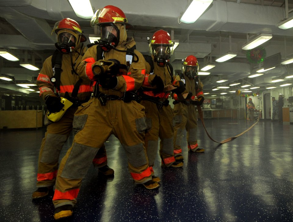 US Navy 111215-N-KA046-125 Sailors fight a mock fire during a general quarters drill