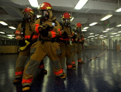 US Navy 111215-N-KA046-125 Sailors fight a mock fire during a general quarters drill