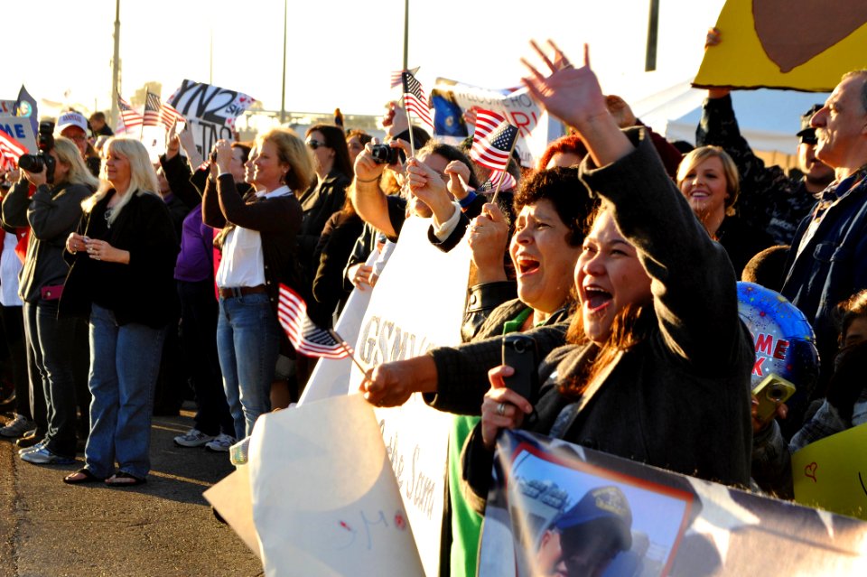 US Navy 111214-N-AW702-001 Friends and family await the arrival of their loved ones