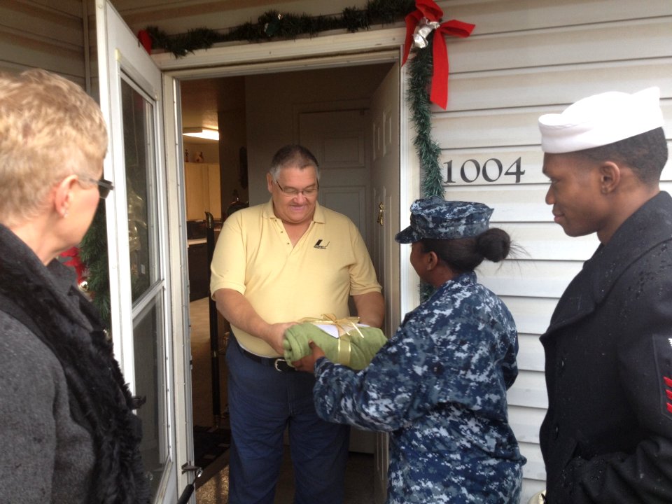 US Navy 111214-N-GO535-026 A Sailor distribute Christmas presents to homebound and elderly people
