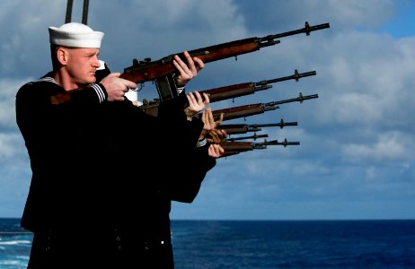 US Navy 111215-N-VO377-022 The rifle detail aboard the Nimitz-class aircraft carrier USS Abraham Lincoln (CVN 72) fires three volleys during a buri photo