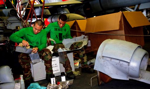 US Navy 111213-N-GC412-031 Sailors wipe down airframe panels