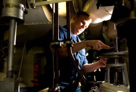 US Navy 111214-N-TZ605-012 Machinist's Mate Fireman Andrew Dyes, assigned to the Nimitz-class aircraft carrier USS Carl Vinson's (CVN 70) engineeri