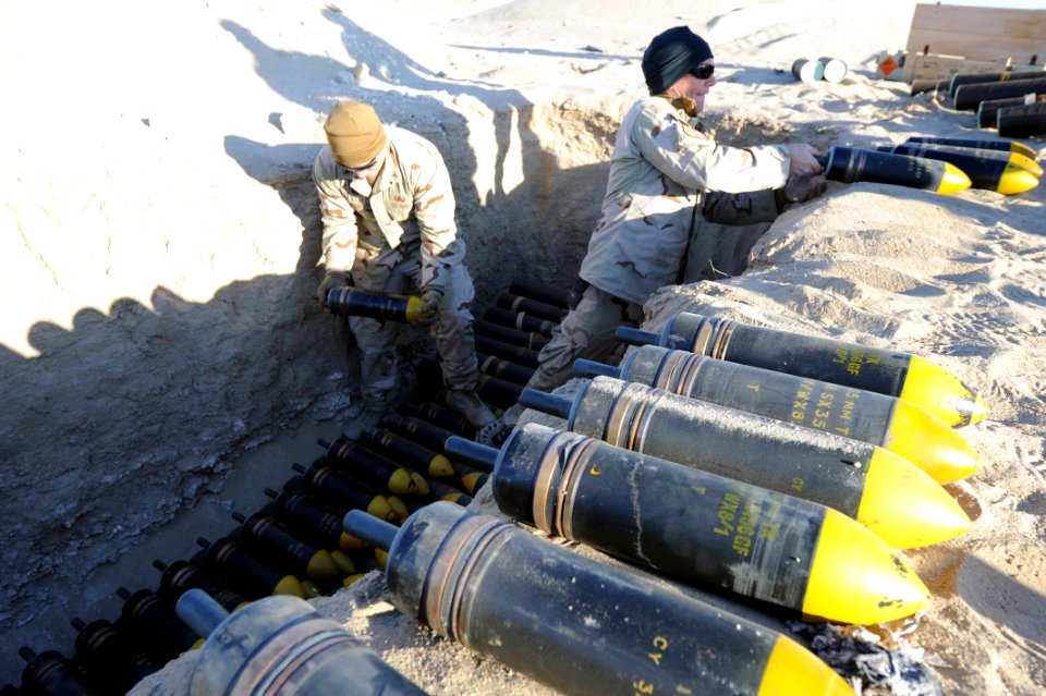 US Navy 111214-N-BA263-276 Explosive ordnance disposal technicians assigned to Commander, Task Group (CTG) 56.1 build a 1,500-pound munitions dispo