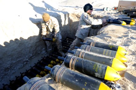 US Navy 111214-N-BA263-276 Explosive ordnance disposal technicians assigned to Commander, Task Group (CTG) 56.1 build a 1,500-pound munitions dispo