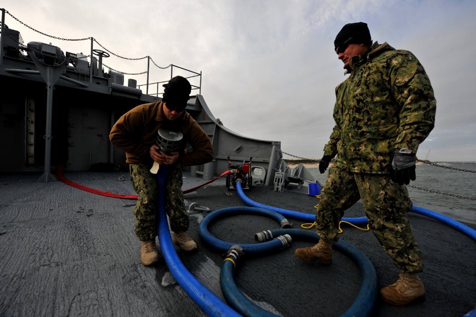 US Navy 111212-N-YO394-045 Navy divers prepare to pump sea water into the forward compartment of the former U.S. Coast Guard buoy tender Salvia bef