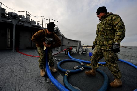 US Navy 111212-N-YO394-045 Navy divers prepare to pump sea water into the forward compartment of the former U.S. Coast Guard buoy tender Salvia bef