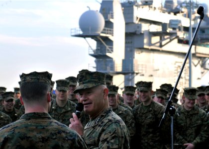 US Navy 111215-N-UM734-123 Lt. Gen. Dennis Hejlik, commanding general, U.S. Marine Corps Forces Command, speaks with junior officers on the flight