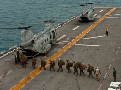 US Navy 111214-N-DX615-090 Marines embark a CH-46E Sea Stallion helicopter photo