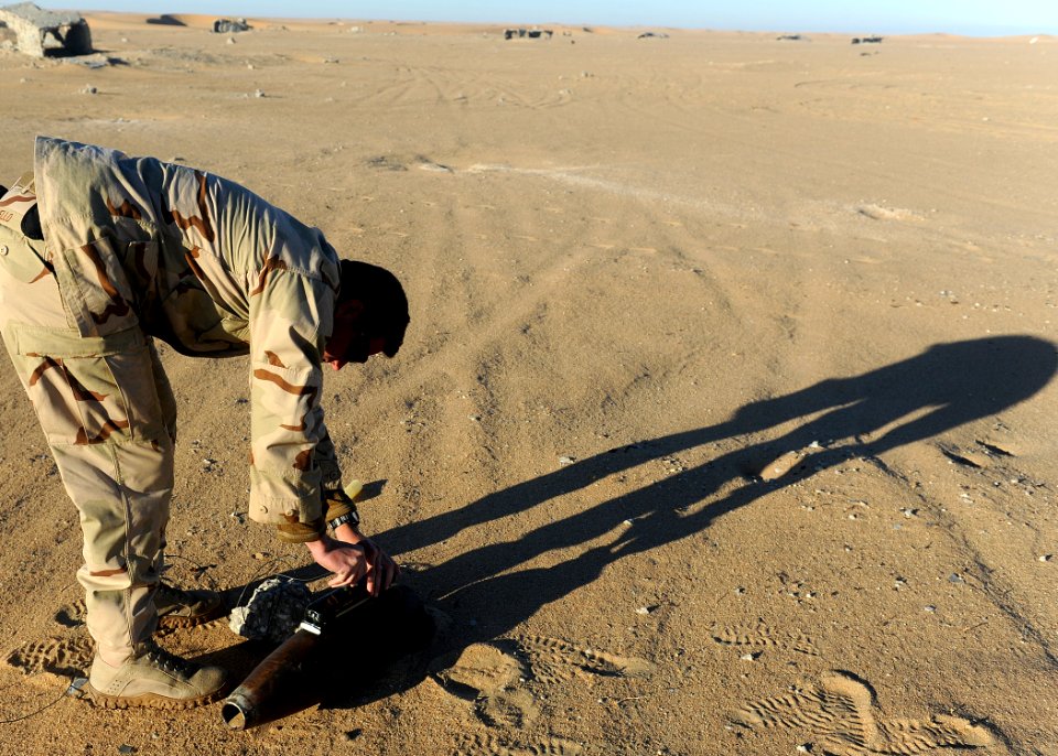 US Navy 111213-N-BA263-706 A Sailor places a non-electric detonator into a composition C-4 demolition charge
