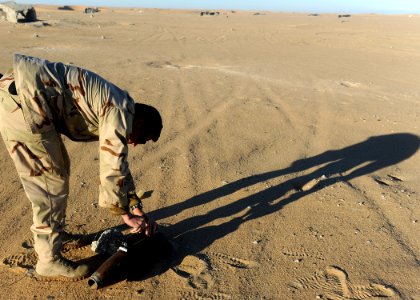 US Navy 111213-N-BA263-706 A Sailor places a non-electric detonator into a composition C-4 demolition charge