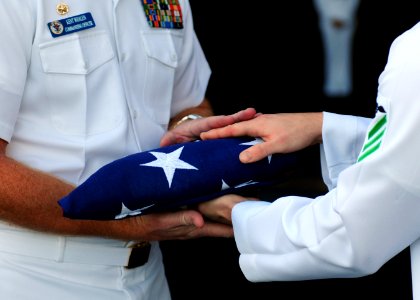 US Navy 111213-N-RG587-372 Capt. Kent D. Whalen, commanding officer of the Nimitz-class aircraft carrier USS Carl Vinson (CVN 70), is presented wi