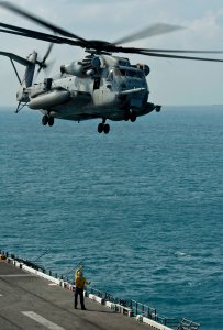 US Navy 111214-N-DX615-367 A CH-53E Super Stallion helicopter takes off from the flight deck of the amphibious assault ship USS Makin Island (LHD 8 photo