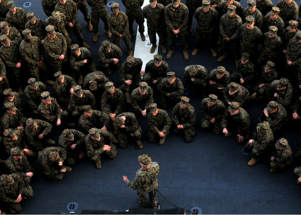 US Navy 111215-N-UM734-074 Lt. Gen. Dennis Hejlik, commanding general, U.S. Marine Corps Forces Command, speaks with junior officers on the flight