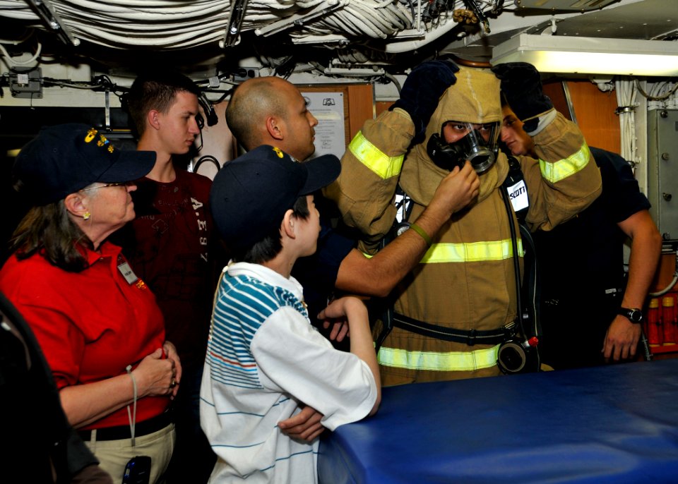 US Navy 111217-N-UK333-121 Machinist Mate 2nd Class Megal Rosado, assigned to the Los Angeles-class submarine USS Chicago (SSN 721) demonstrates to