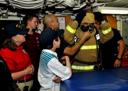 US Navy 111217-N-UK333-121 Machinist Mate 2nd Class Megal Rosado, assigned to the Los Angeles-class submarine USS Chicago (SSN 721) demonstrates to