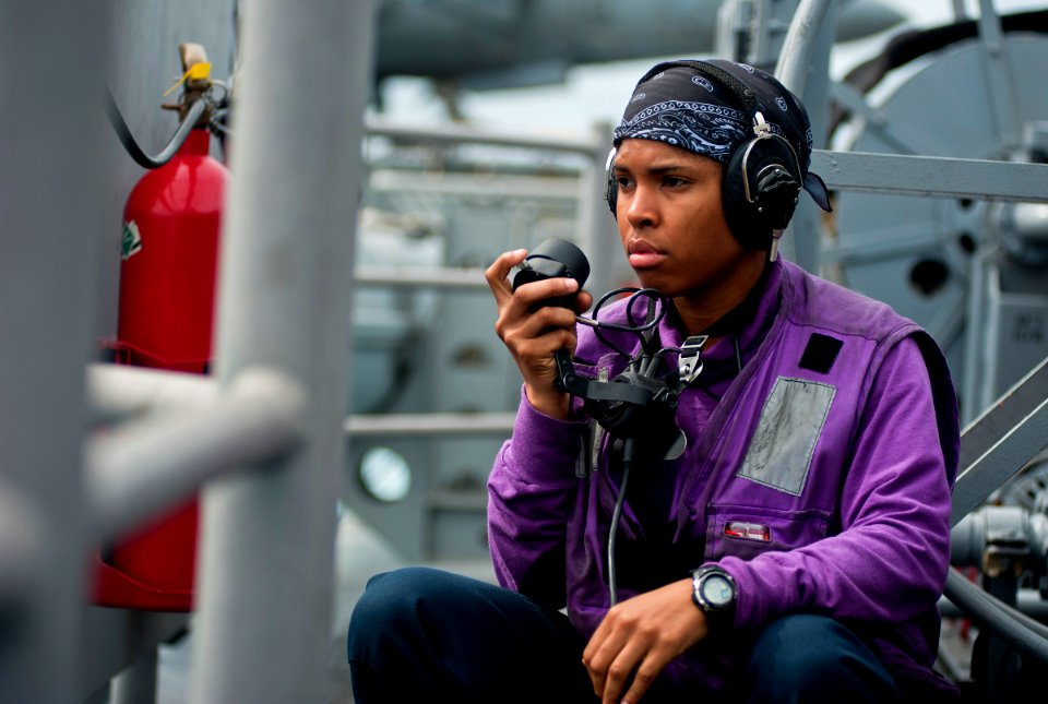 US Navy 111220-N-DX615-054 Aviation Boatswain's Mate (Fuels) Airman Charetta Frierson, stands fuels phone talker watch during an underway replenish