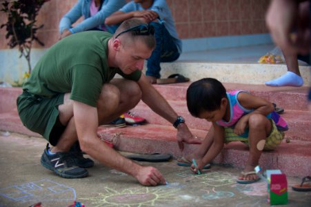 US Navy 111219-N-PB383-631 Marine Maj. Brett Ellis, assigned to Marine Medium Helicopter Squadron (HMM) 268 Reinforced embarked aboard the amphibio