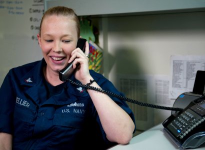 US Navy 111216-N-DR144-060 Mass Communication Specialist 3rd Class Megan Catellier talks with Taylor Kitsch, star of the upcoming film