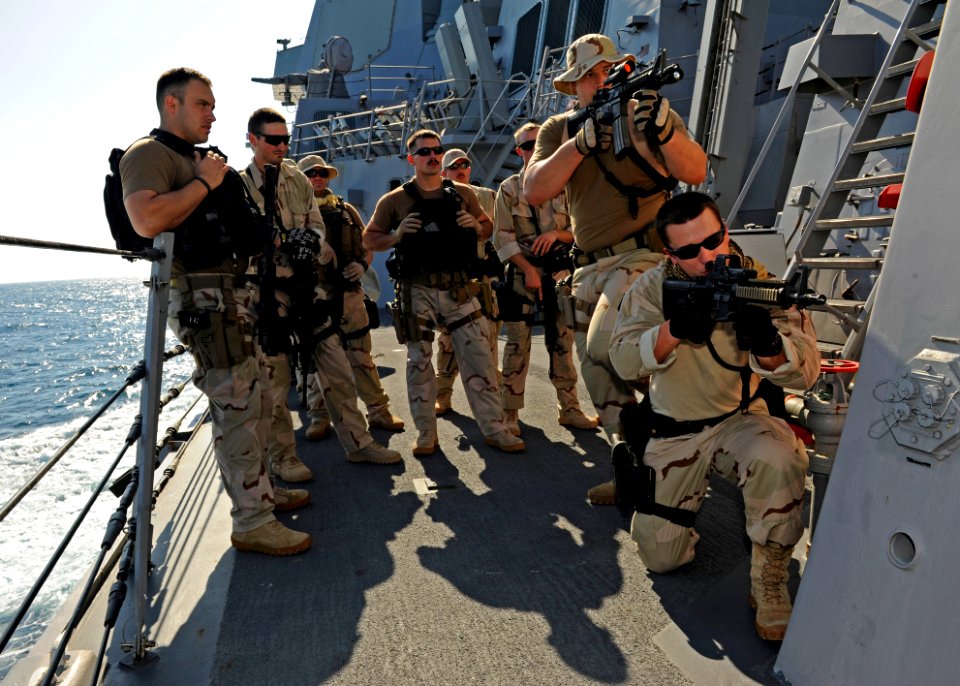 US Navy 111216-N-VH839-119 Sailors and U.S. Coast Guardsmen train together during a visit, board, search, and seizure training exercise aboard the