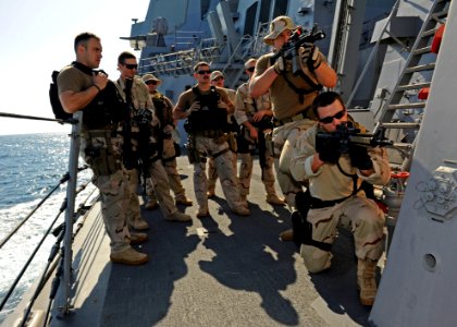 US Navy 111216-N-VH839-119 Sailors and U.S. Coast Guardsmen train together during a visit, board, search, and seizure training exercise aboard the