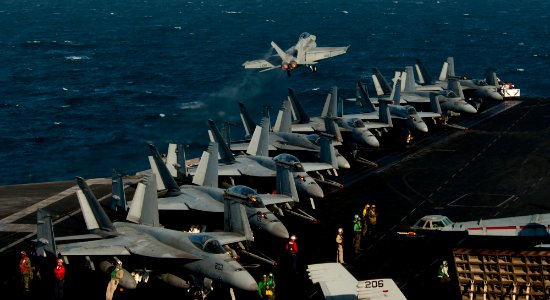 US Navy 111219-N-OY799-037 An F-A-18F Super Hornet from the Black Aces of Strike Fighter Squadron (VFA) 41 launches off the flight deck of the Nimi